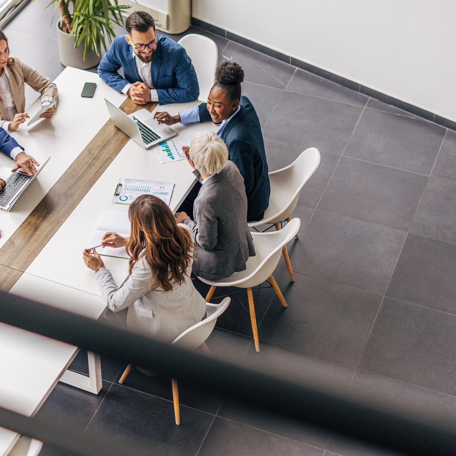 Work colleagues reviewing report at the office