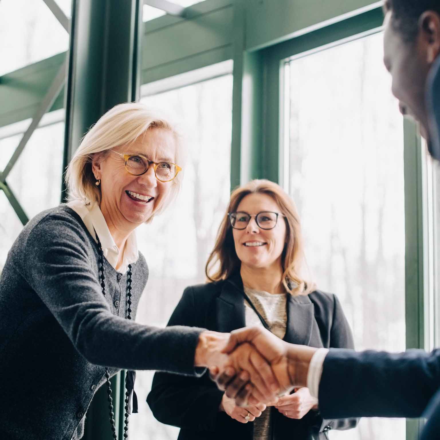 Senior business woman greeting