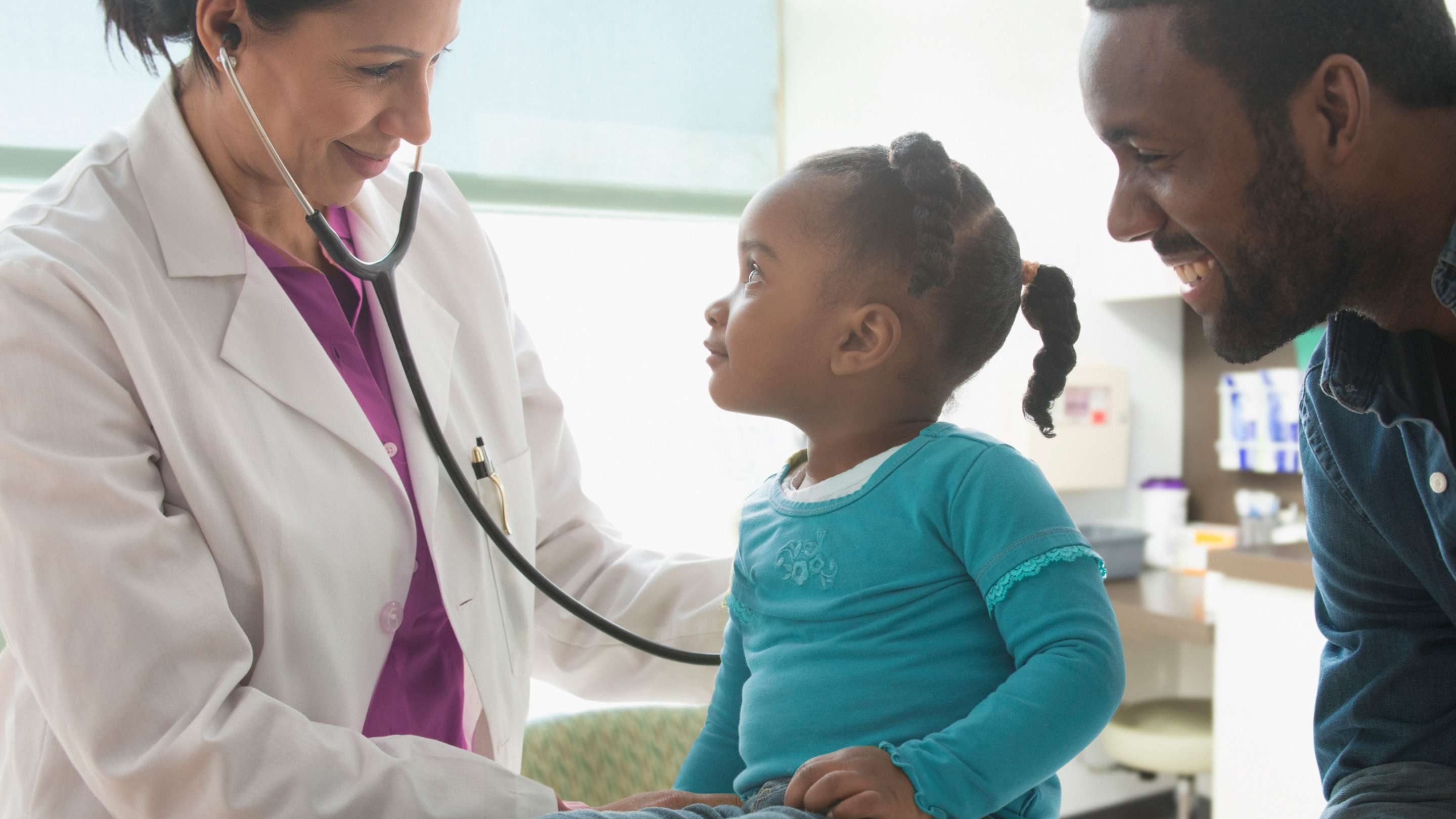 Doctor listening to heartbeat of patient