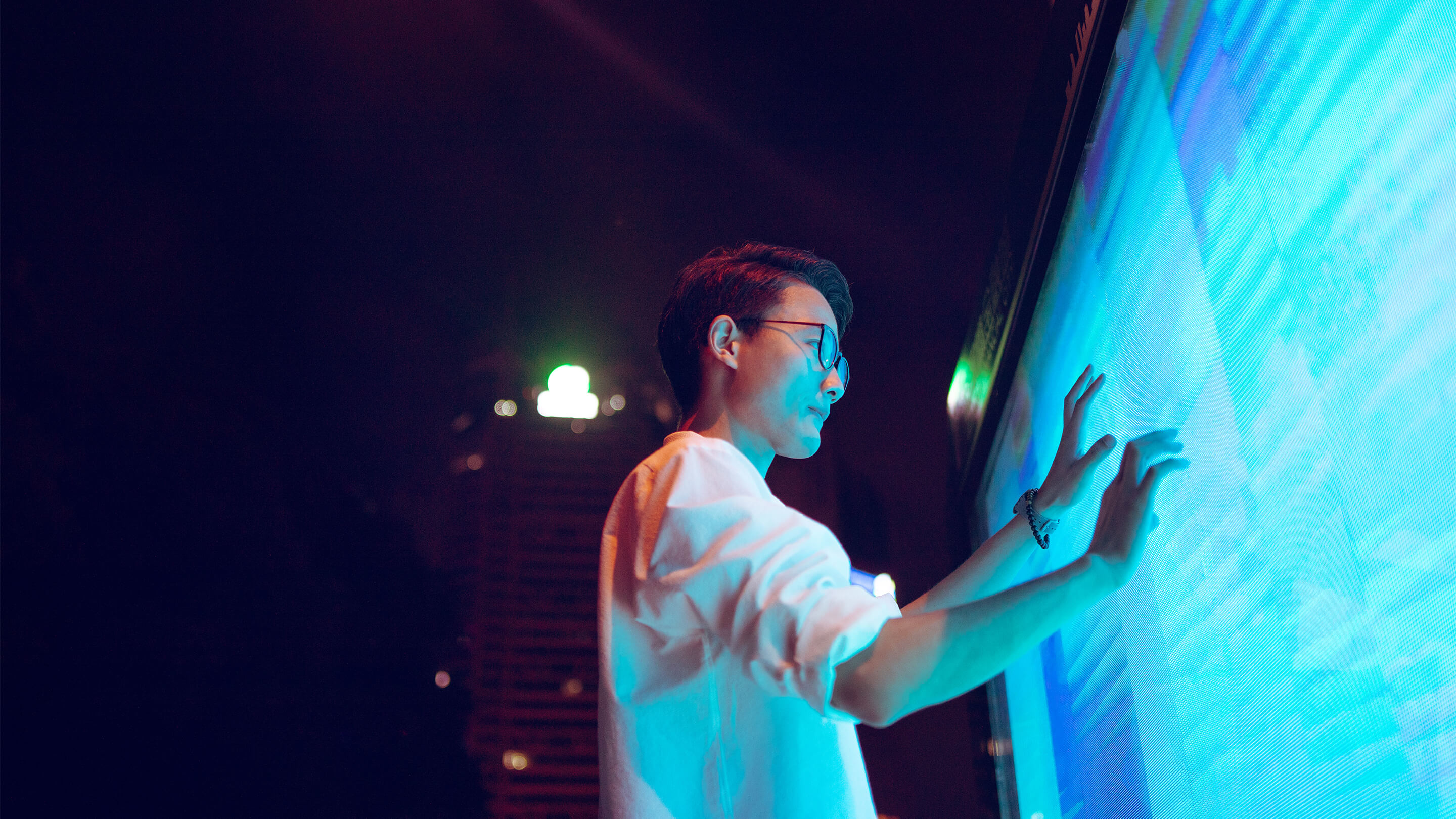 Man using large touch screen