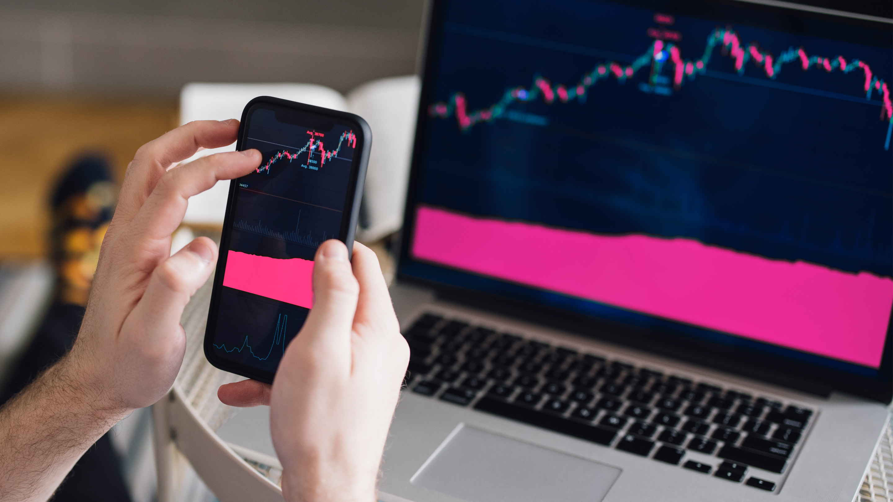 Work at home: Man Analyzing Crypto Graph On Laptop Screen