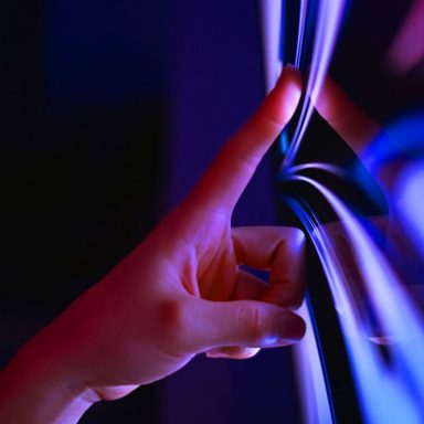 Finger clicking on computer screen