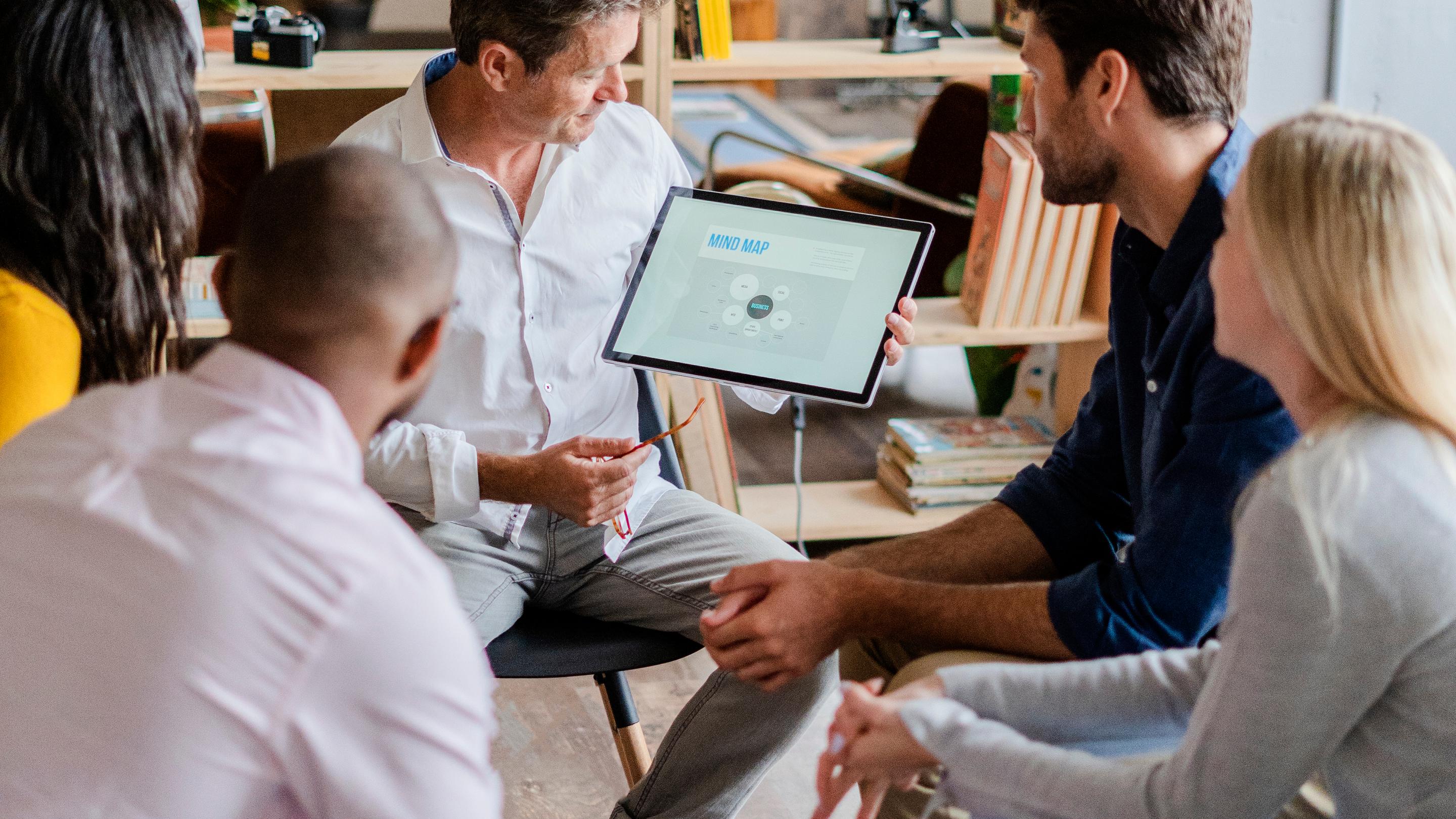 Businessman leading a presentation in loft office
