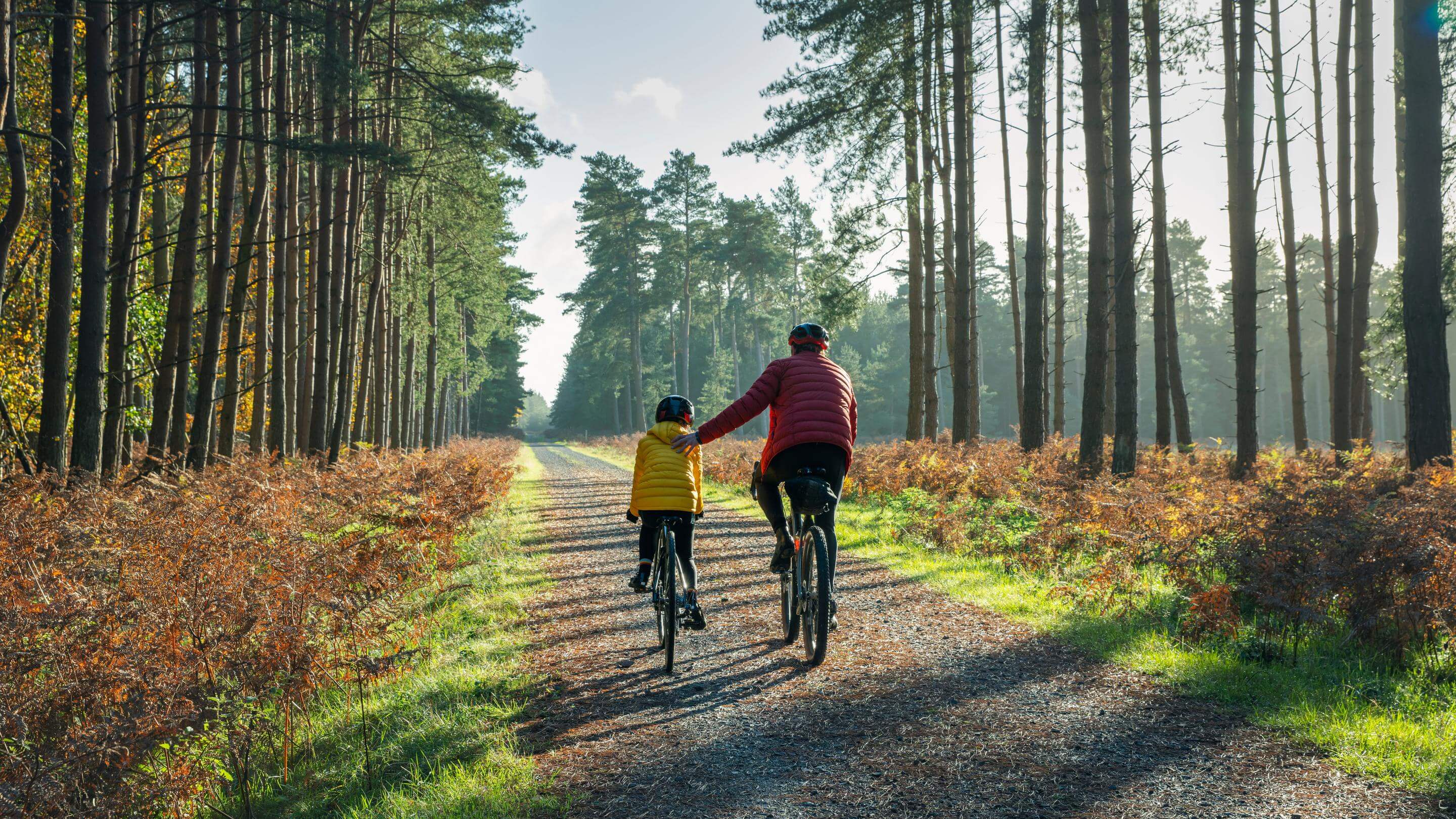 The mature father helps his daughter by giving her a helping hand