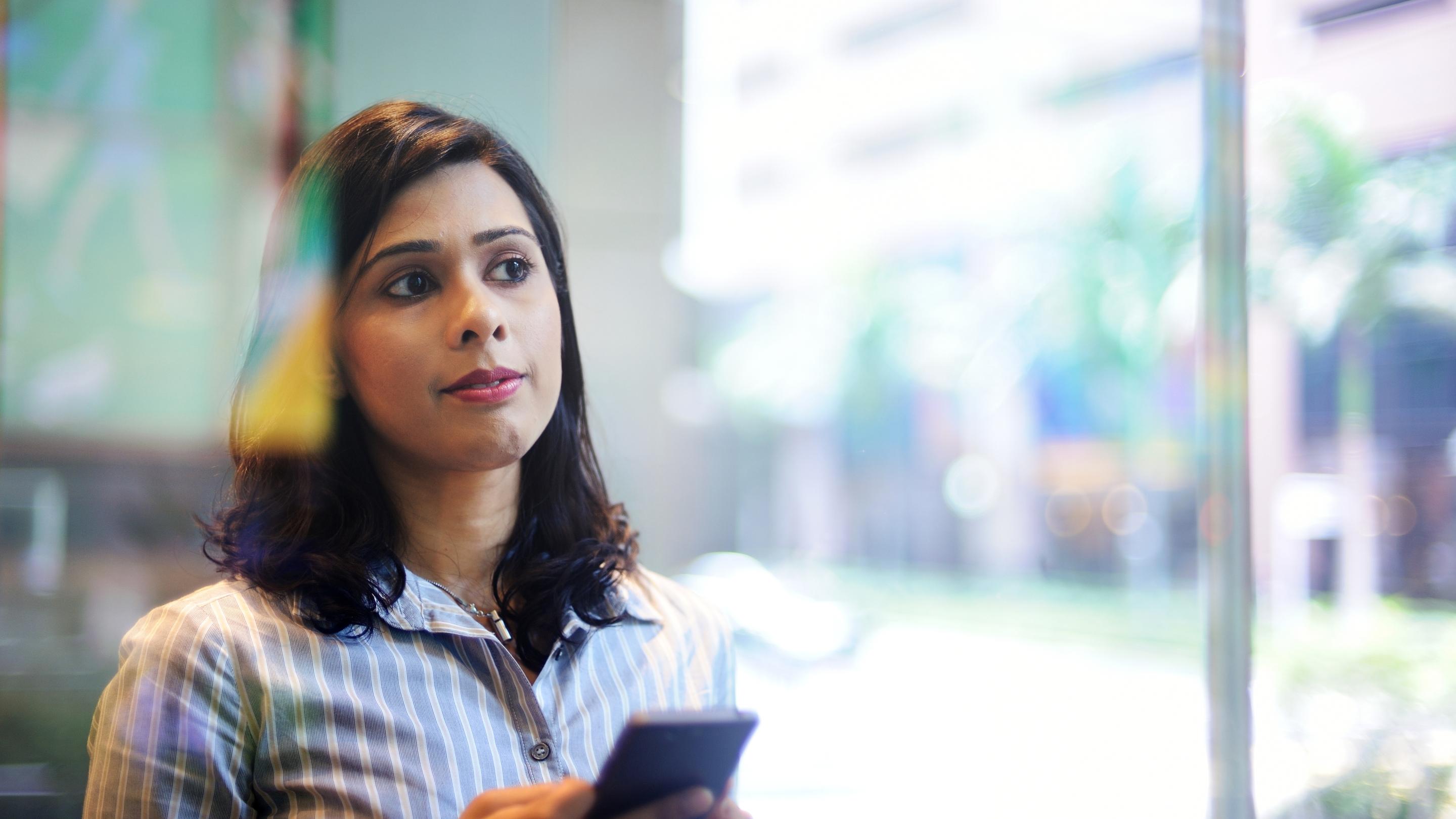 young-women-holding-smartphone-looking