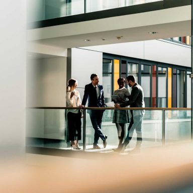  Business people talking on office floor