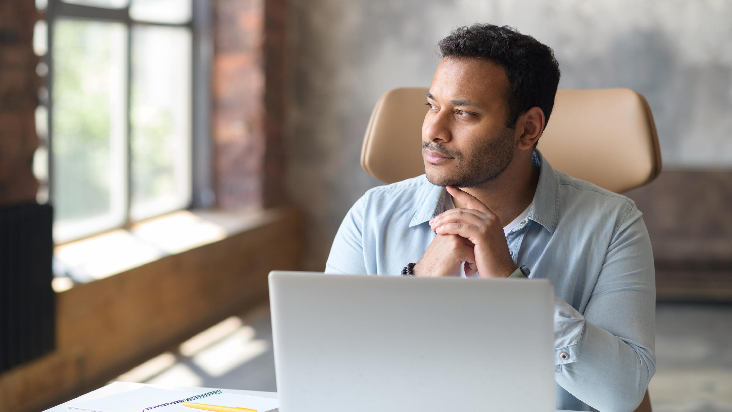 Young male concentrated laptop working
