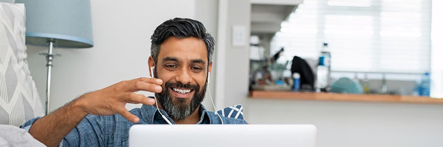 man smiling in online meeting