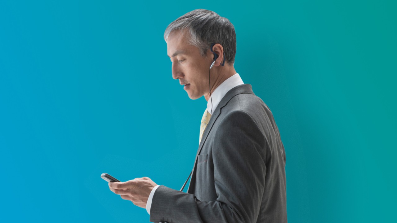 487704577 man holding cell phone