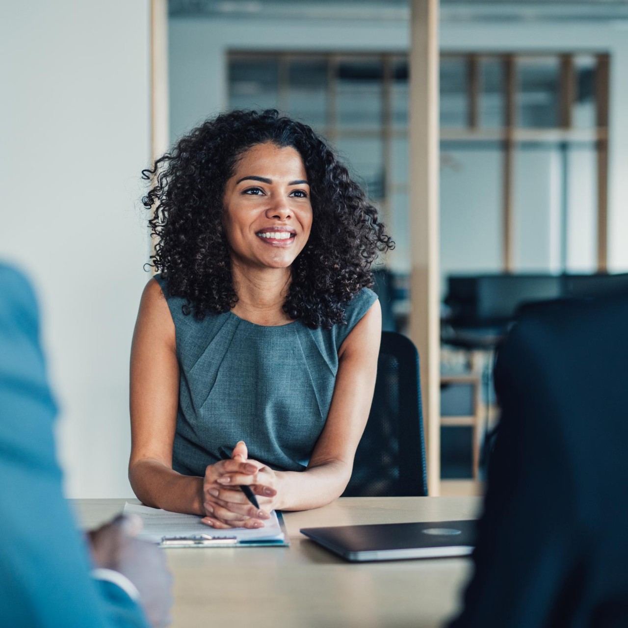 Female manager discussing new project with her colleagues