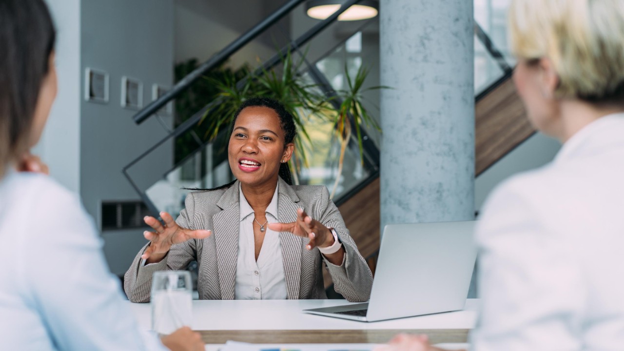 Three female entrepreneurs on meeting in board room
