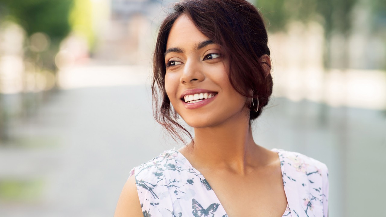 portrait of happy smiling indian woman outdoors