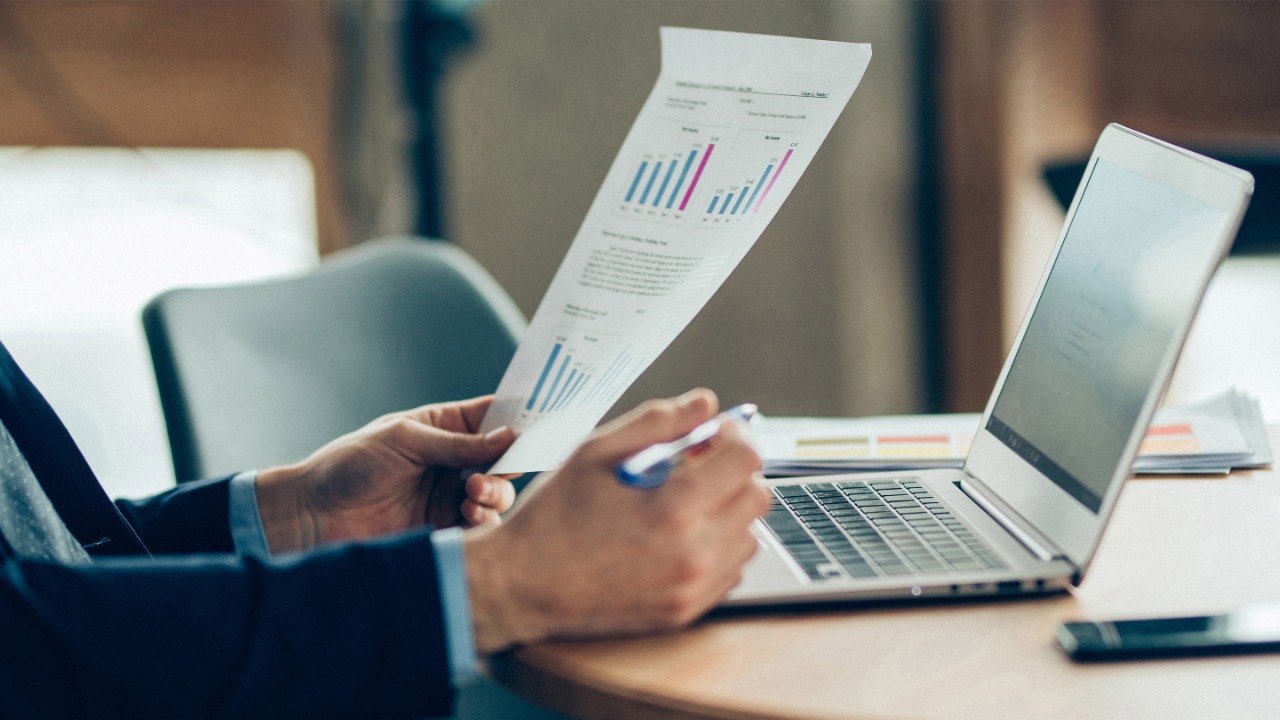 Hands of Businessman Notebook and documents working