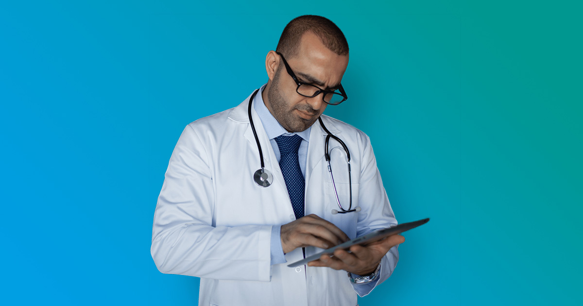 A male doctor working with his tablet