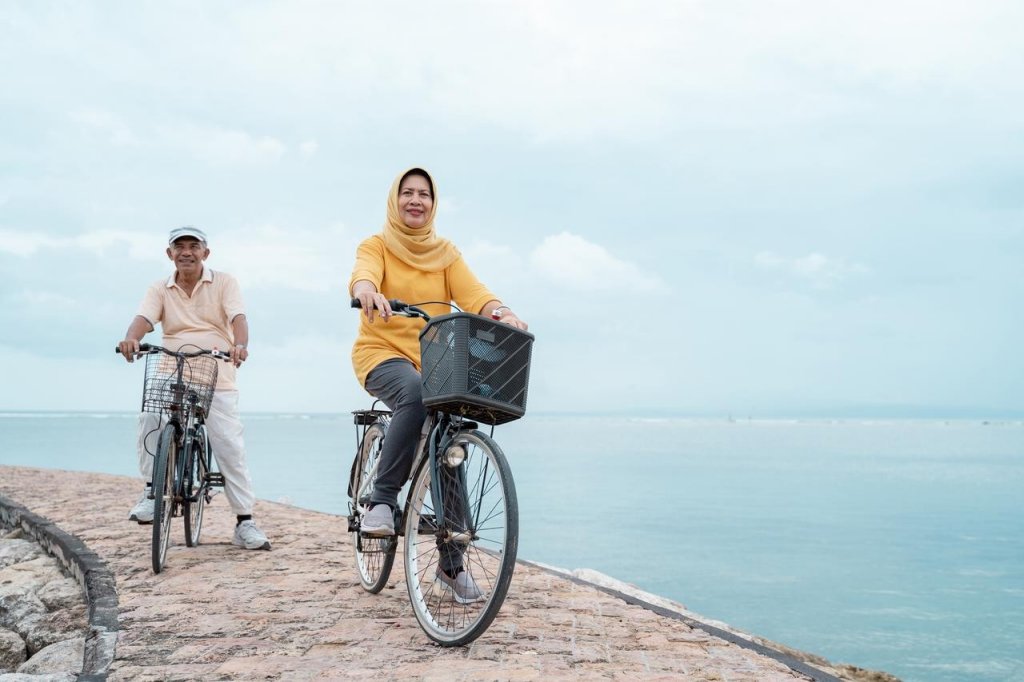 Woman and man riding bicycles 1280x853