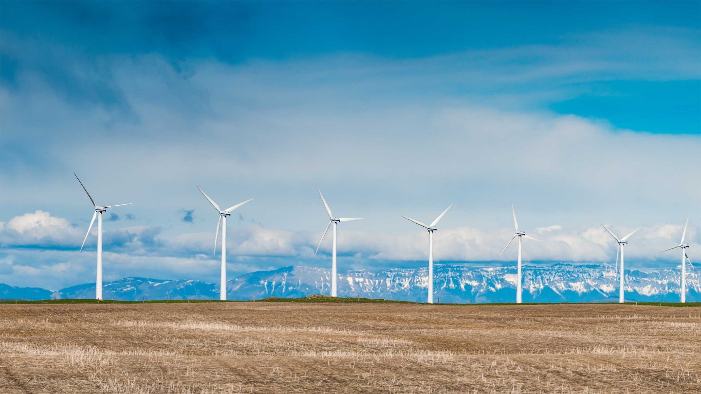Electrical power generting windmills in the prairies and foothills of the Rocky Mountains Alberta Canada