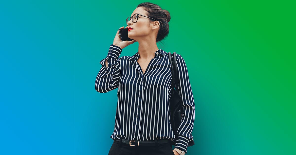Woman in a stripy shirt holding smartphone 1200x630