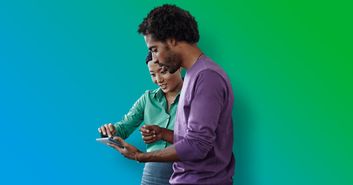 couple look at the tablet 