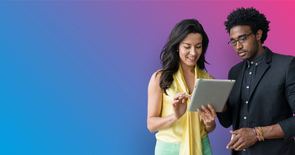 woman and man sharing a tablet