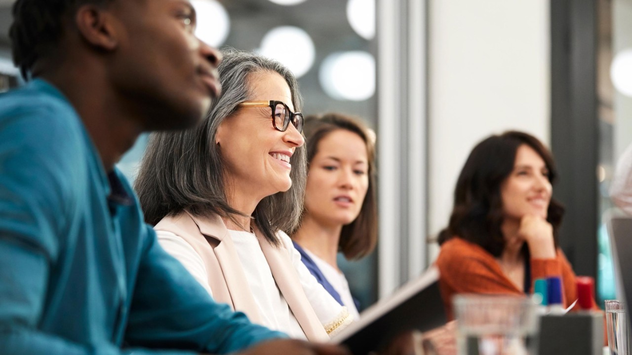 closeup of smiling colleague in meeting