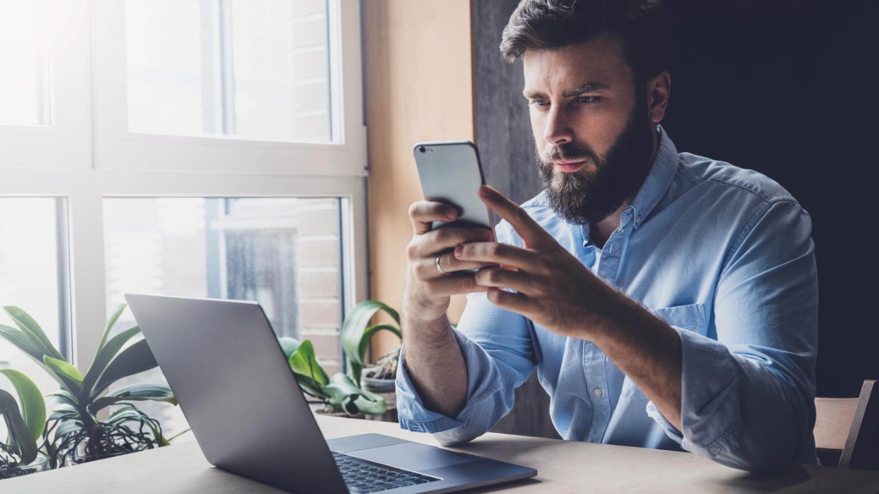 Male adult checking email