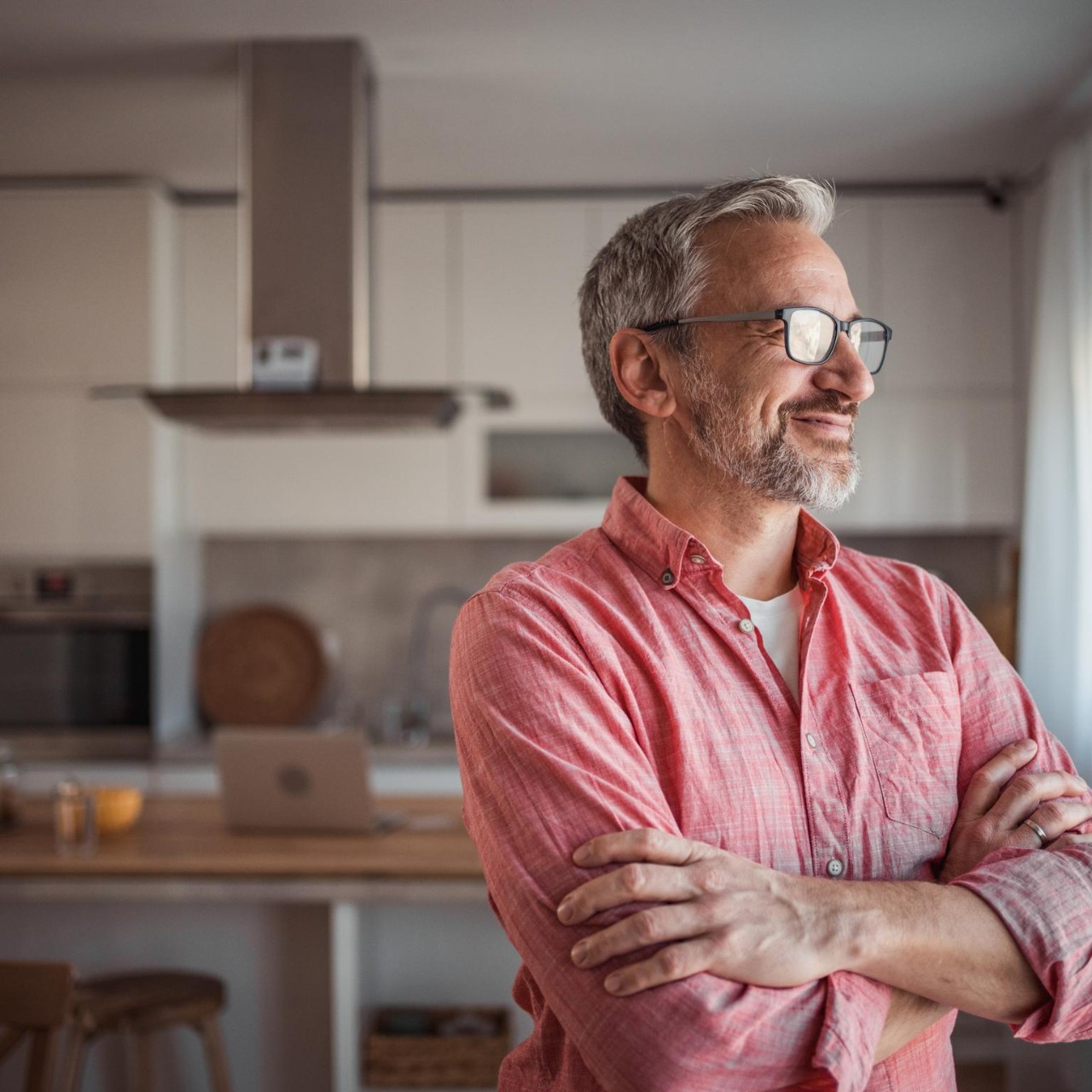 man looking out of the window and smiling