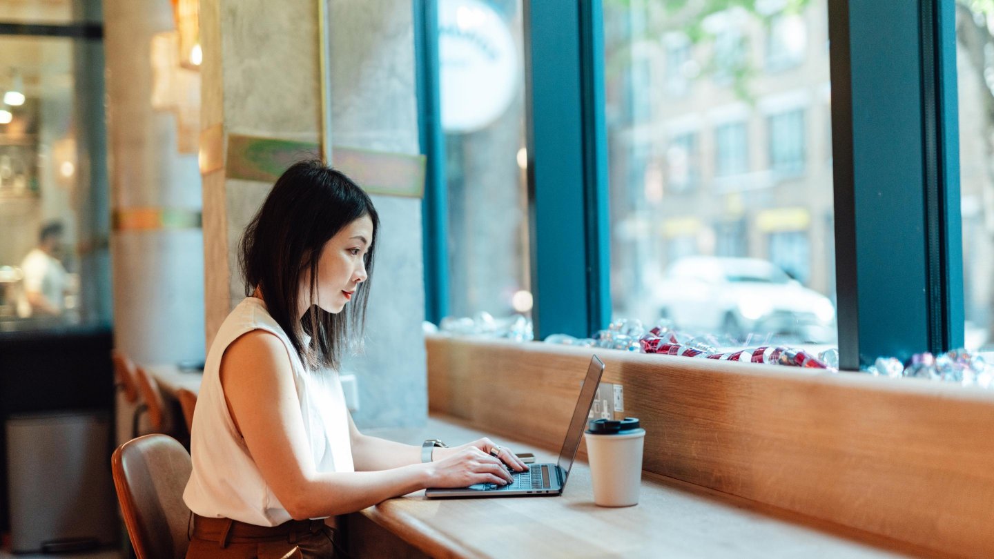 Woman on laptop making investment decision