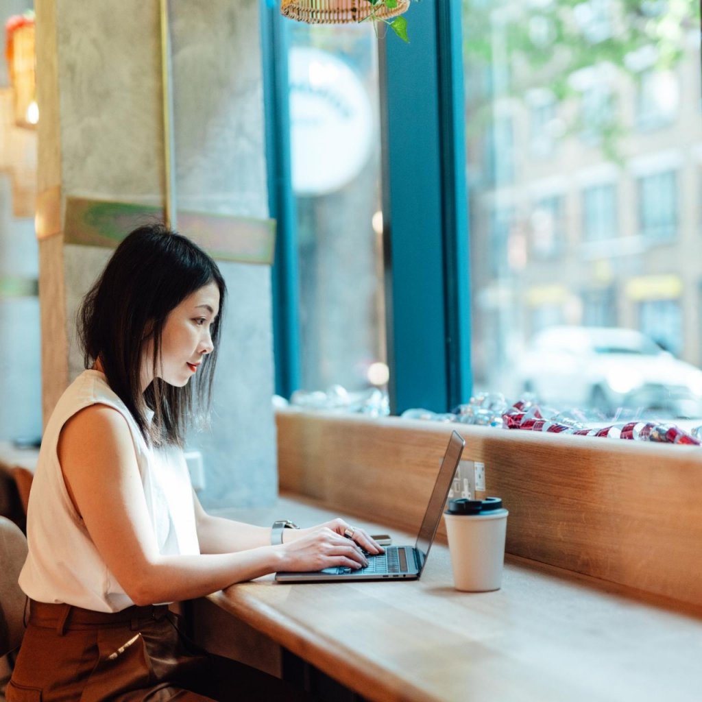 Woman on laptop making investment decision