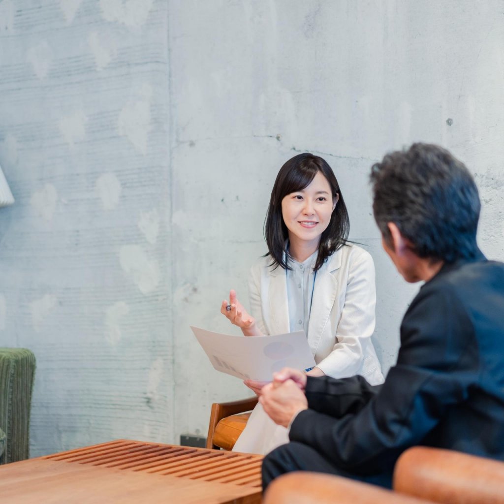 Saleswoman soliciting insurance for businessman
