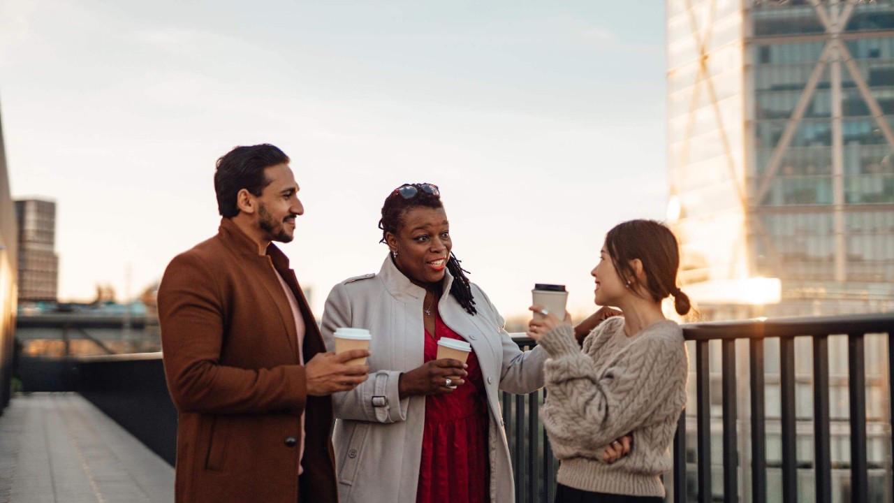 Multi-ethnic business people talking about work and life