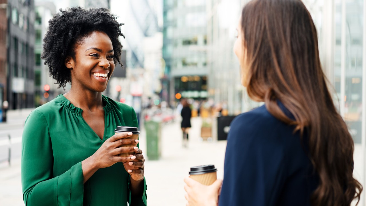 Woman sharing coffee together