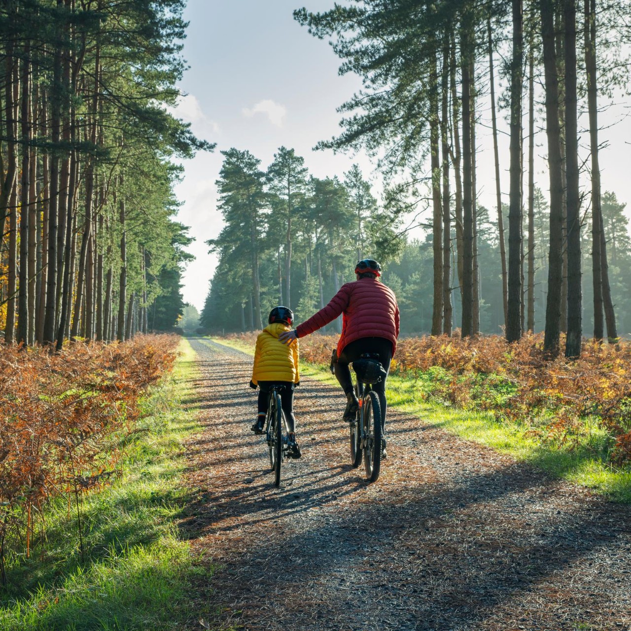 The mature father helps his daughter by giving her a helping hand
