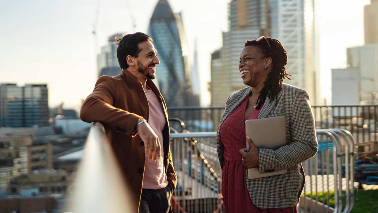 Multiracial business team having work discussion at rooftop
