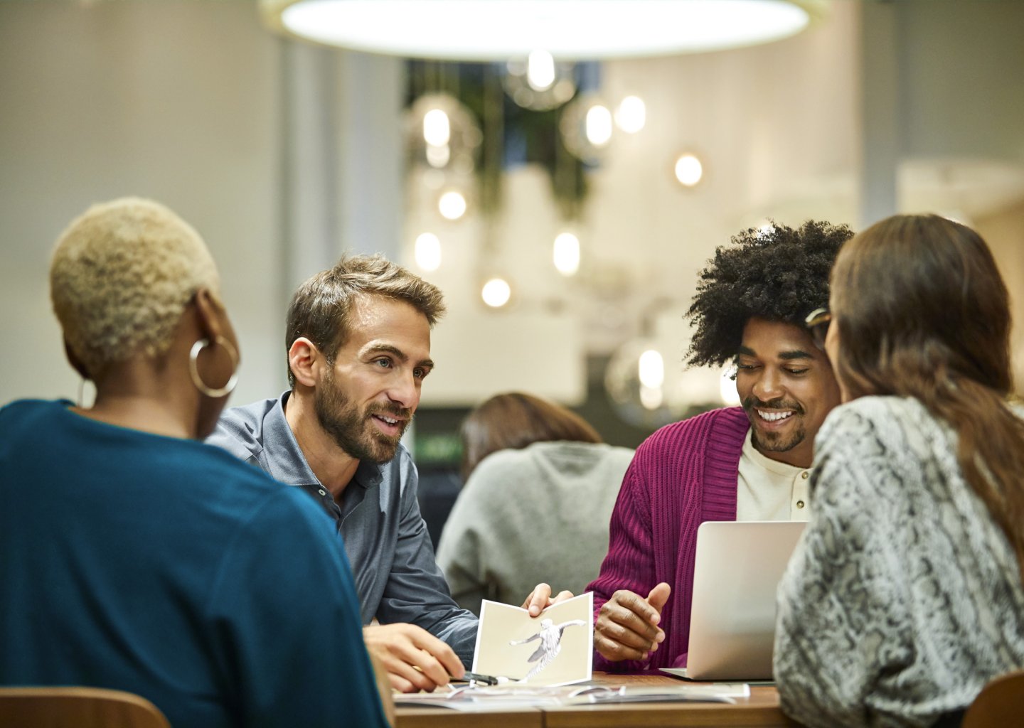 Multi-ethnic coworkers discussing in office