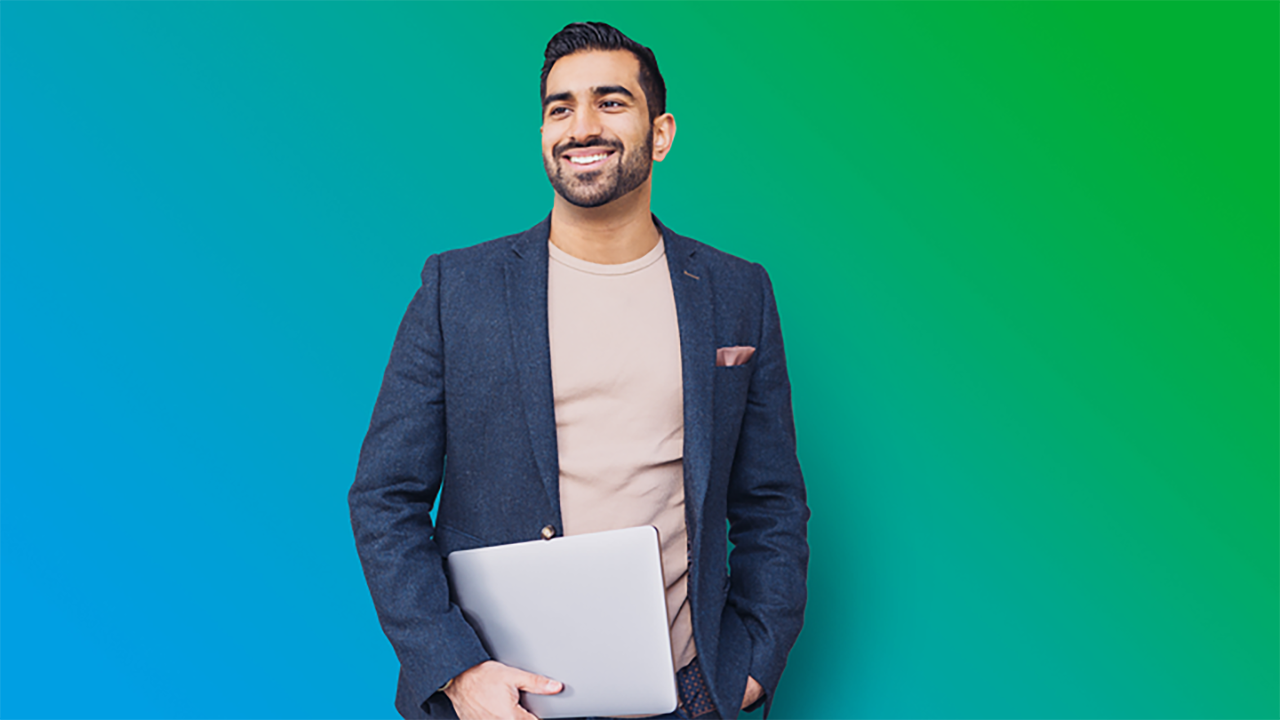Boy with laptop smiling