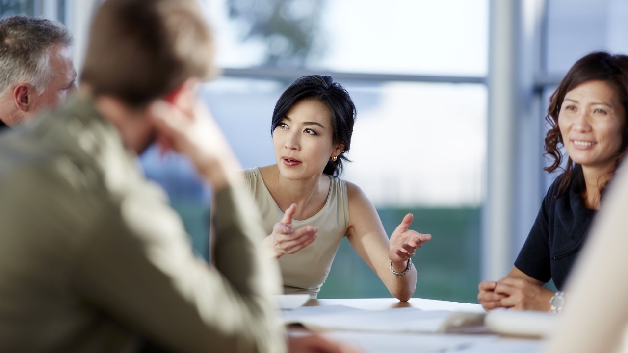 457983783 Business people talking in meeting