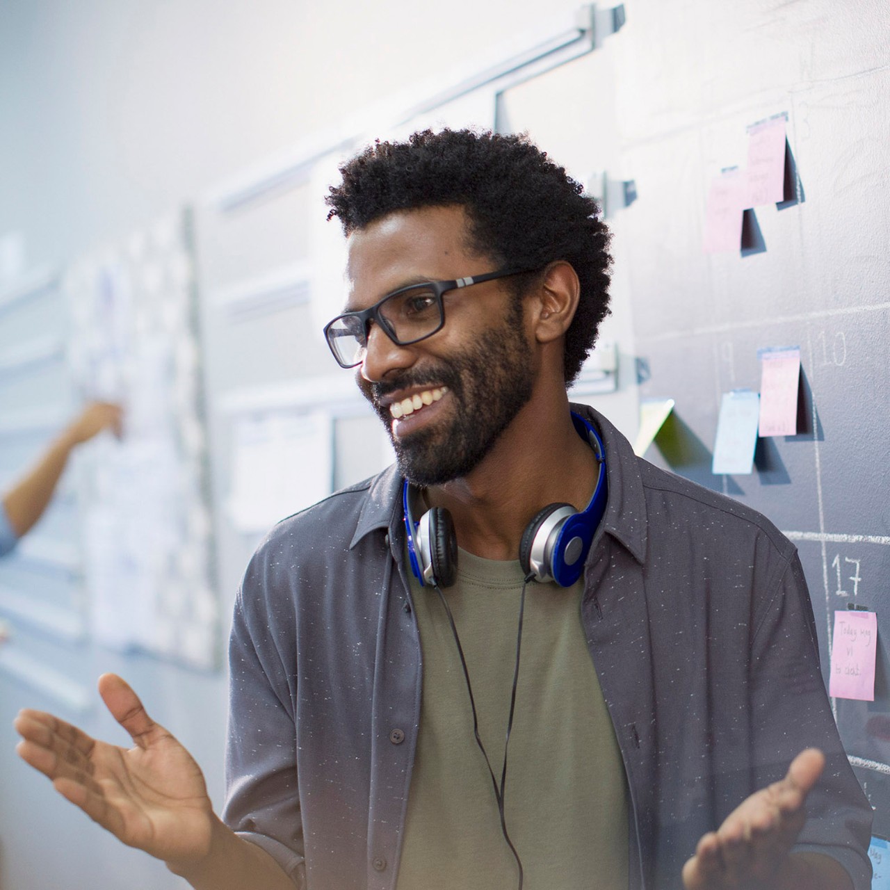 Happy, confident creative businessman planning, scheduling at calendar blackboard