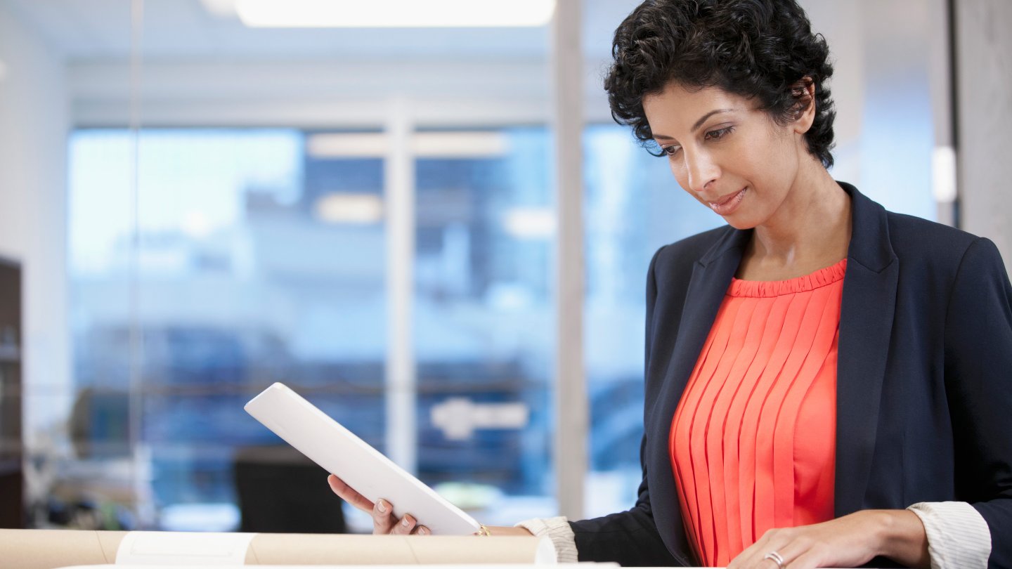  Businesswoman reviewing papers