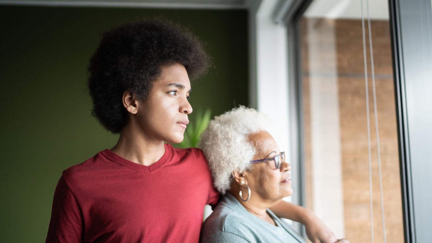  Grandmother and grandson contemplating at home