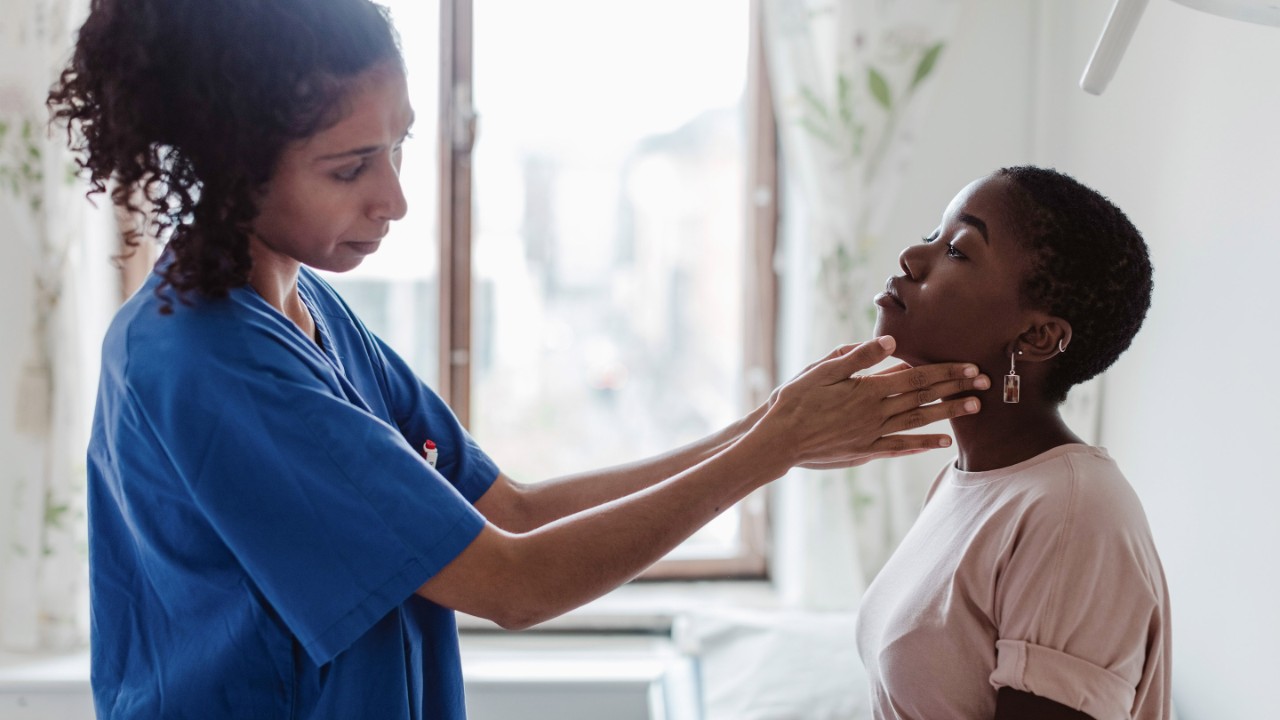female assessing patient