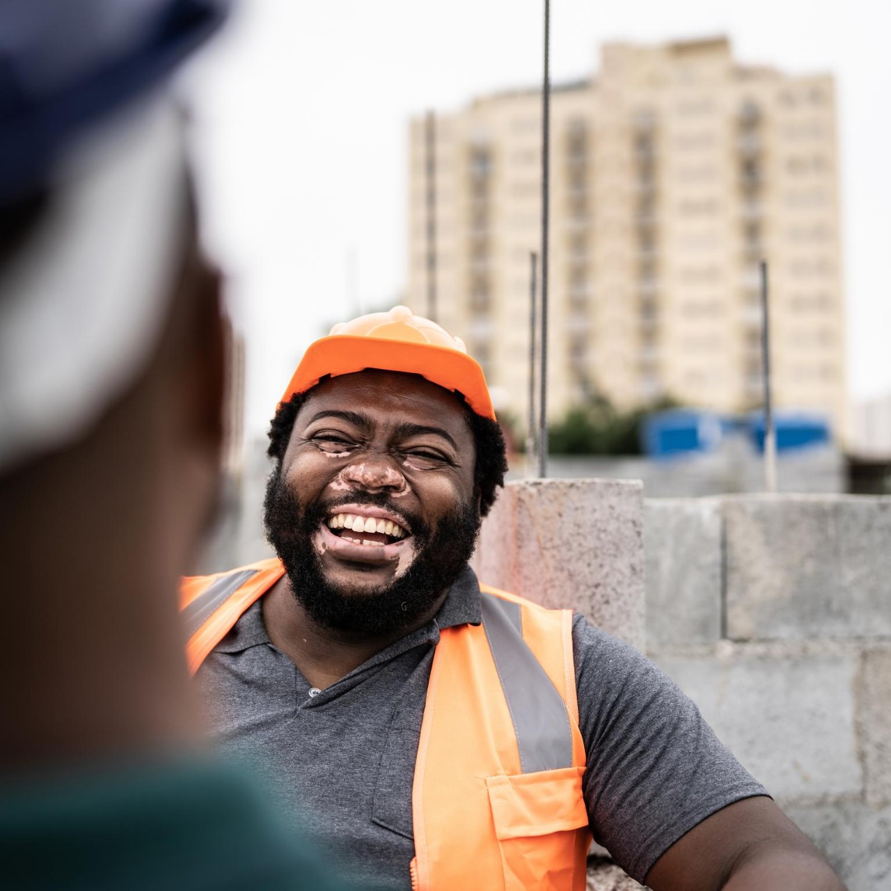 Coworkers talking in a construction site