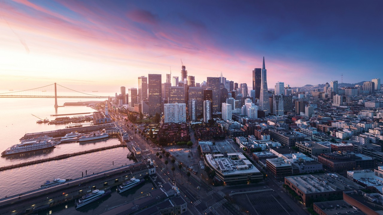 San Francisco panorama at sunrise with waterfront and downtown. California theme background. Art photograph.