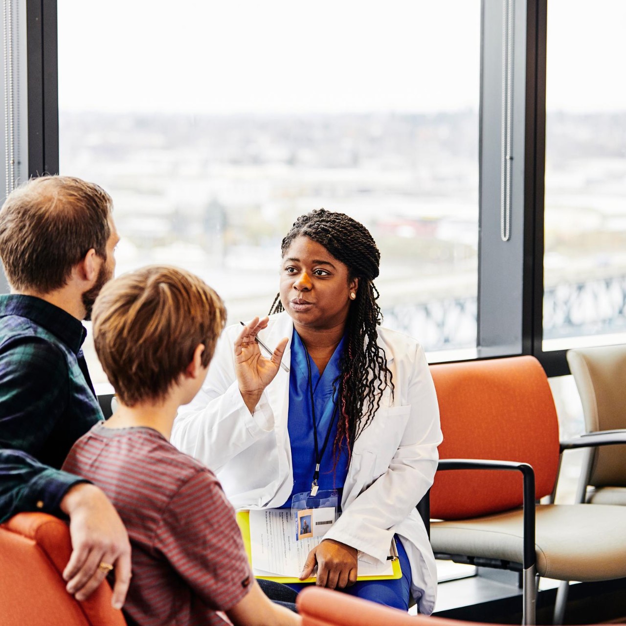 doctor talking to a couple