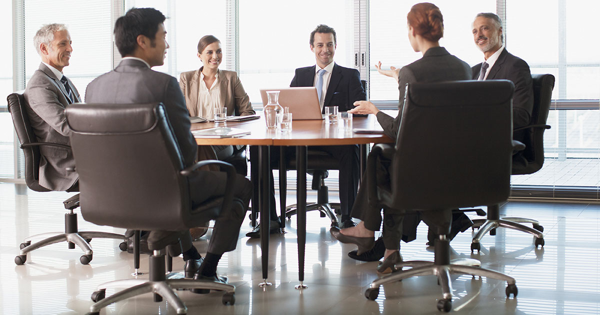 Businesspeople meeting at table in conference room