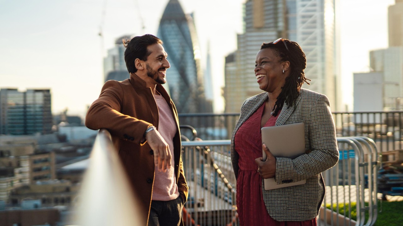 Multiracial business team having work discussion at rooftop