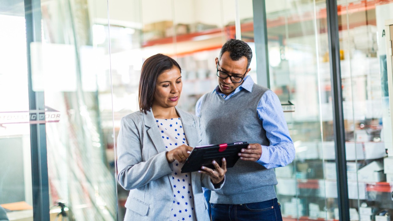 colleagues viewing an ipad
