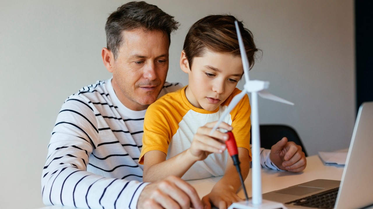 BARCELONA, SPAIN. FATHER AND SON AT HOME