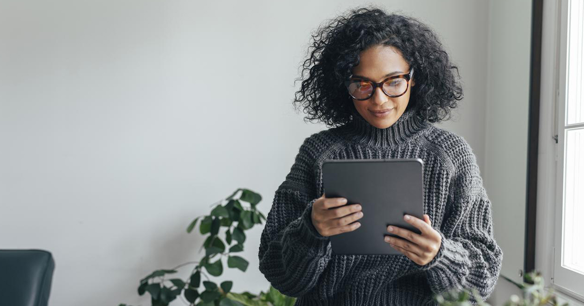 Image of a woman reading her iPad