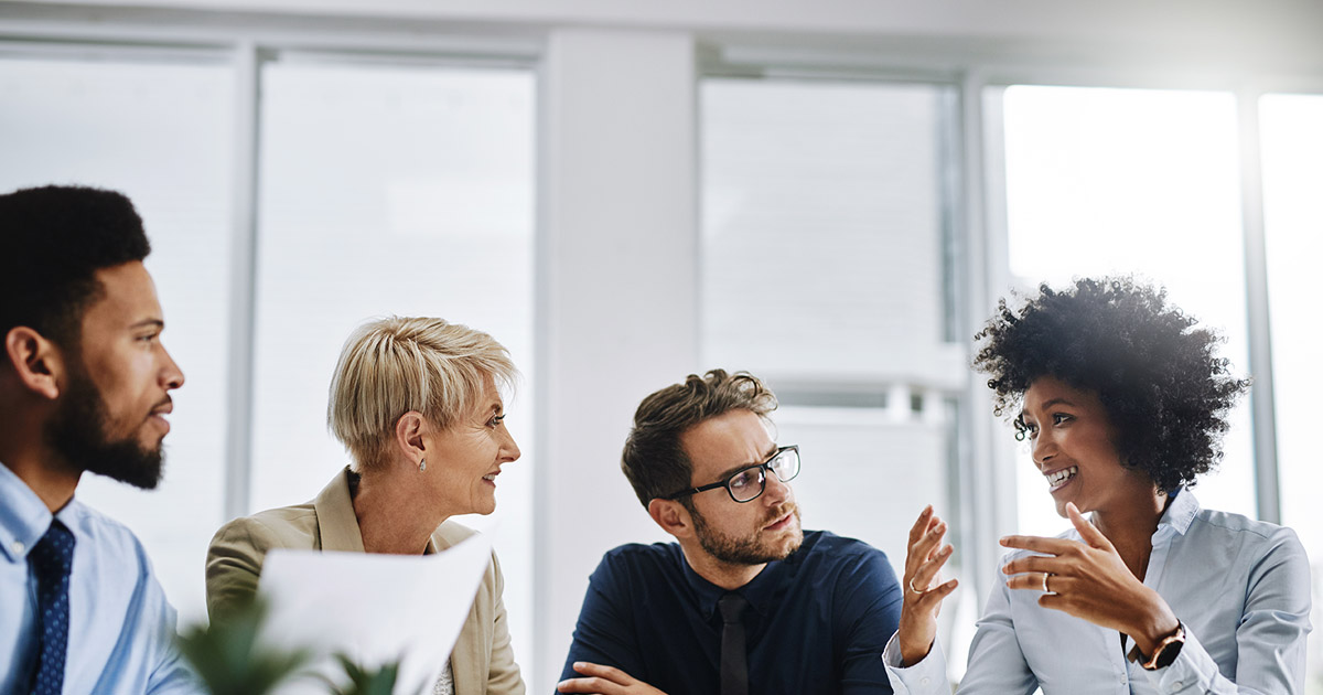 Shot of a group of businesspeople sitting together in a meeting