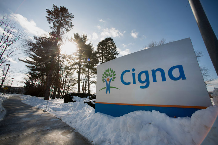 Snow covers the ground around Cigna Corp. signage displayed at the company's headquarters in Bloomfield, Connecticut, U.S., on Friday, Feb. 6, 2015. Obamacare's startup health insurance plans are flirting with financial distress, as all but five of the 23 nonprofit companies had negative cash flow from operations in the first three quarters of 2014, Standard & Poor's said in a report Tuesday. Photographer: Ron Antonelli/Bloomberg via Getty Images